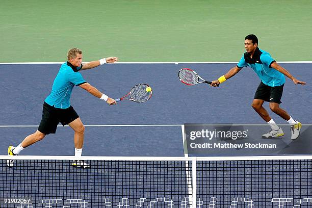 Mark Knowles of the Bahamas returns a shot to Luzasz Kubot of poland and Oliver marach of Austria while playing with Mahesh Bhupathi of India during...