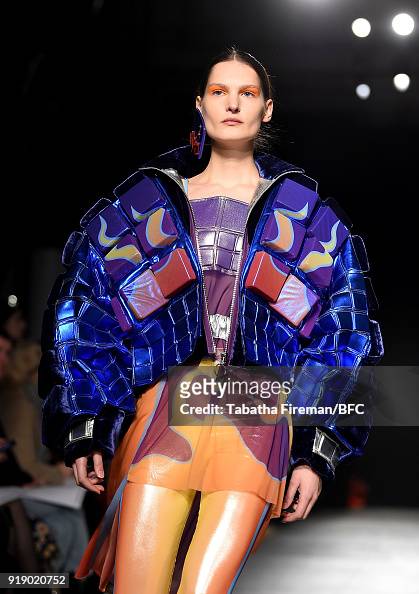 A model walks the runway at the University of Westminster BA show ...