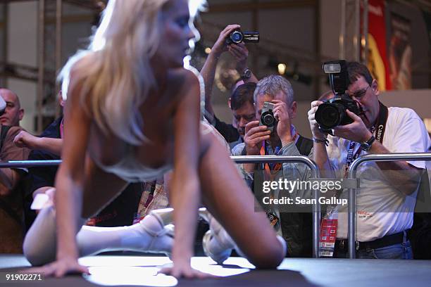 Stripper performs at the Venus erotic trade fair during the press and industry professionals' day on October 15, 2009 in Berlin, Germany. Venus will...