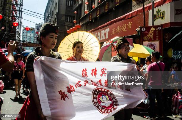 Chinese-Filipinos participate in a parade in a Chinese New Year celebration in China Town, Manila, Philippines, on 16 February 2018 .