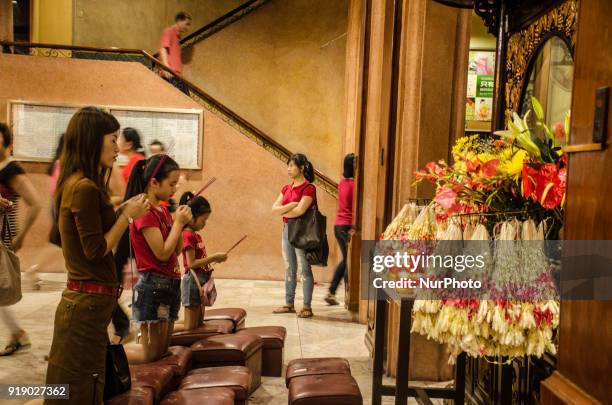 Chinese-Filipinos visit the a Buddhist temple in Manila, Philippines, on 16 February 2018 to pray during the Chinese New year.