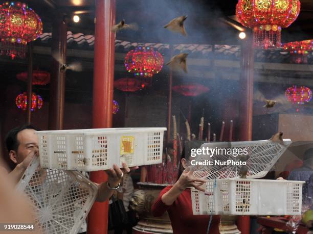 Girl releases birds to get a luck as she celebrate Chinese new year at Dharma Bakti Temple in Jakarta, Indonesia on February 16, 2018. The new lunar...