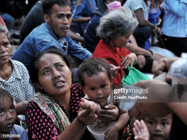 Man gives money &quot;angpao&quot; to the poor as part of Chinese new year celebration at Dharma Bakti Temple in Jakarta, Indonesia on February 16,...