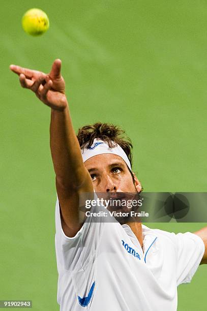 Feliciano Lopez of Spain serves to Jurgen Melzer of Austria during day five of 2009 Shanghai ATP Masters 1000 at Qi Zhong Tennis Centre on October...