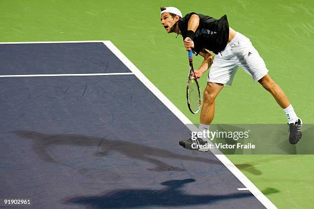 Jurgen Melzer of Austria serves to Feliciano Lopez of Spain during day five of 2009 Shanghai ATP Masters 1000 at Qi Zhong Tennis Centre on October...