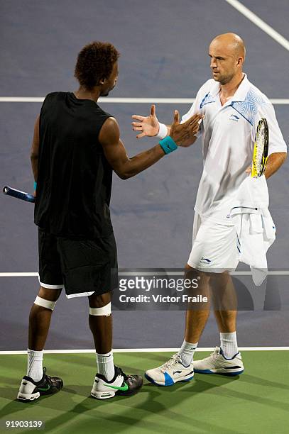Gael Monfils of France congratulates Ivan Ljubicic of Croatia after retiring from the match during day five of 2009 Shanghai ATP Masters 1000 at Qi...