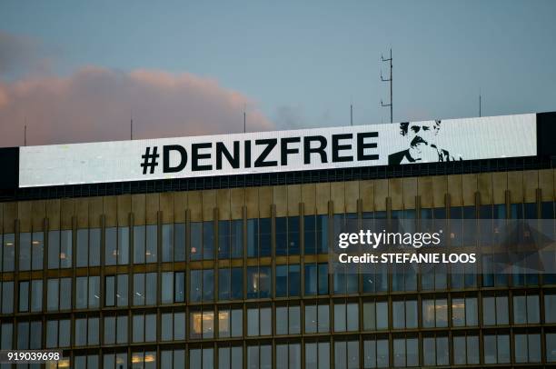 An inscription reading "Denizfree" is seen on the top of the headquarters of German newspaper "Die Welt" on February 16, 2018 in Berlin, after Turkey...