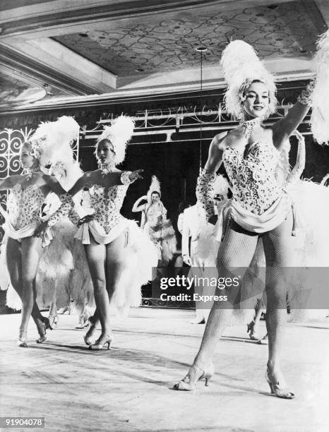 Showgirl Molly Dexter on stage at the Lido in Paris with the Bluebell Girls, 25th May 1957. Molly, who weighed just over 10 stone, was recently sent...