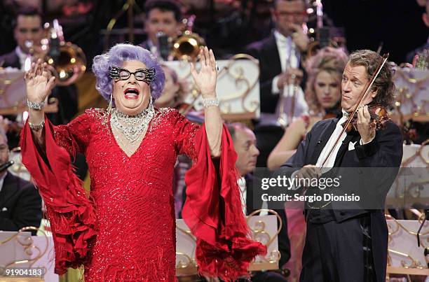 Australian icon Dame Edna Everage performs alongside musician Andre Rieu on stage at Acer Arena on October 15, 2009 in Sydney, Australia.