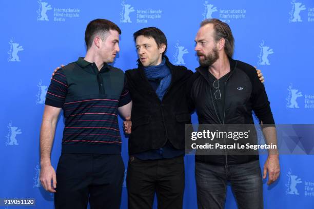 James Frecheville, Lance Daly and Hugo Weaving poses at the 'Black 47' photo call during the 68th Berlinale International Film Festival Berlin at...