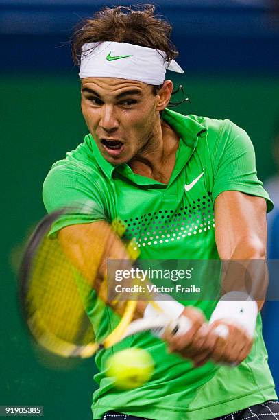 Rafael Nadal of Spain returns a shot to his compatriot Tommy Robredo during day five of 2009 Shanghai ATP Masters 1000 at Qi Zhong Tennis Centre on...