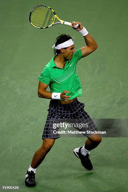 Rafael Nadal of Spain returns a shot to Tommy Robredo of Spain during day five of the 2009 Shanghai ATP Masters 1000 at Qi Zhong Tennis Centre on...