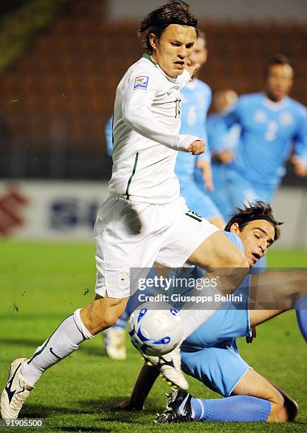 Zlatko Dedic of Sloveniaand Davide Simoncini of San Marino in action during the FIFA 2010 World Cup Group 3 Qualifying match between San Marino and...