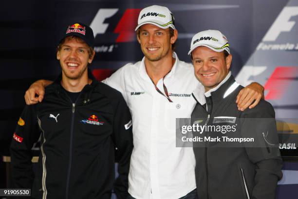 Formula One World Championship rivals Sebastian Vettel of Germany and Red Bull Racing, Jenson Button of Great Britain and Brawn GP and Rubens...