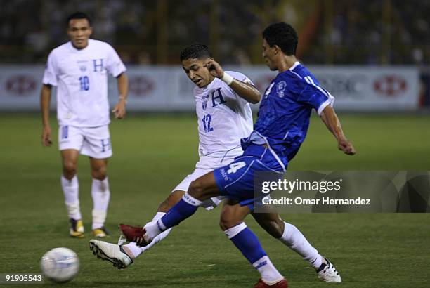 Emilio Izaguirez of Honduras vies for the ball with Ramon Flores of El Salvador during their match as part of the 2010 FIFA World Cup Qualifier at...