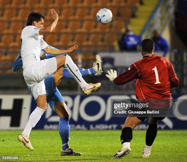 Andraz Kirm of Slovenia and Aldo Junior Simoncini of San Marino in action during the FIFA 2010 World Cup Group 3 Qualifying match between San Marino...