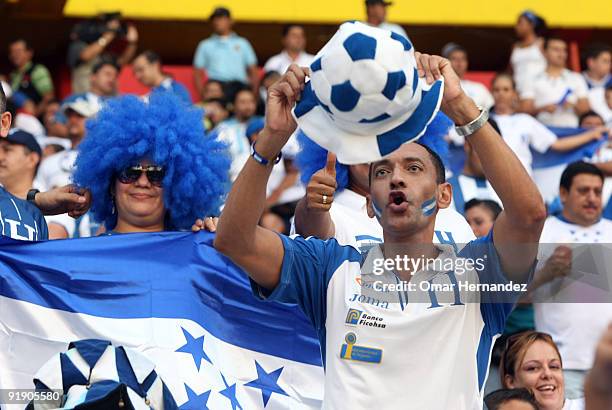 Hondura's fans cheer their team during the match against El Salvador as part of FIFA 2010 World Cup Qualifier at Cuscatlan Stadium on October 14,...