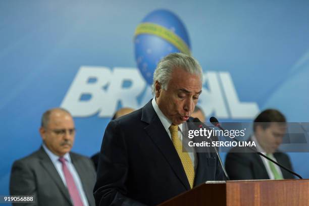 Brazilian President Michel Temer speaks during the signature of a decree to send in the army to lead public safety in Rio de Janeiro state, at the...