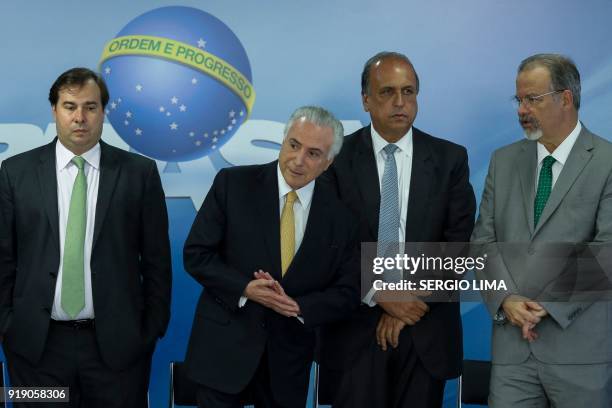 Brazilian President Michel Temer, deputy Rodrigo Maia, Rio de Janeiro's Governor Luiz Fernando Pezao and Defense Minister Raul Jungmann are pictured...