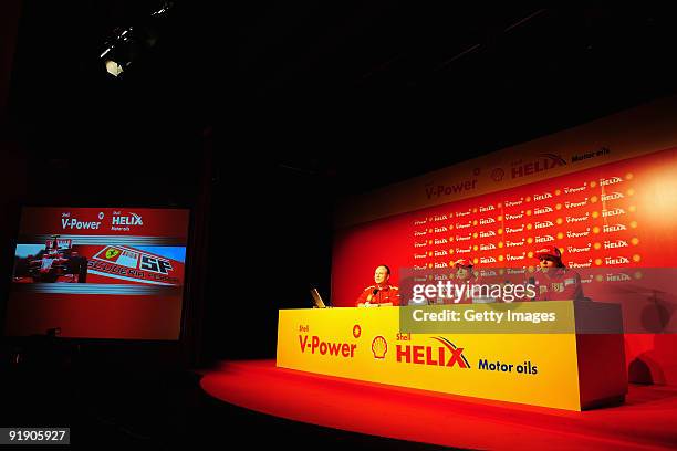 Giancarlo Fisichella of Italy and Ferrari and Kimi Raikkonen of Finland and Ferrari talk at a Shell press conference during previews to the Brazilian...