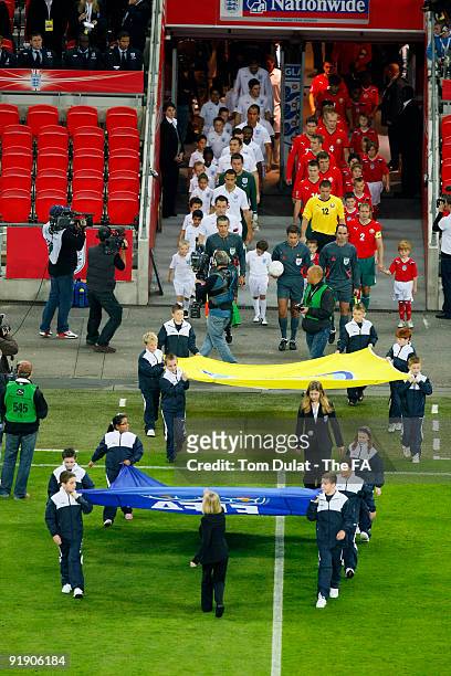 The England and Belarus team walk out of the team during the FIFA 2010 World Cup Qualifier match between England and Belarus at Wembley Stadium on...