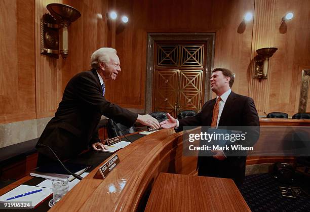 Chairman Joseph Lieberman shakes hands with John Berry , Director of the Office of Personnel Management during a Senate Homeland Security and...