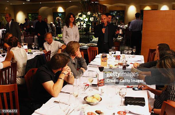 Richard Bracewell welcomes guests to a Shell Ferrari dinner during previews to the Brazilian Formula One Grand Prix at Interlagos Circuit on October...