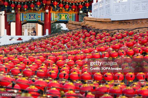 Foreigner seen behind hundreds of lanterns at the Thean Hou Temple on the first day of Chinese New Year. Chinese New Year is the first day of the New...