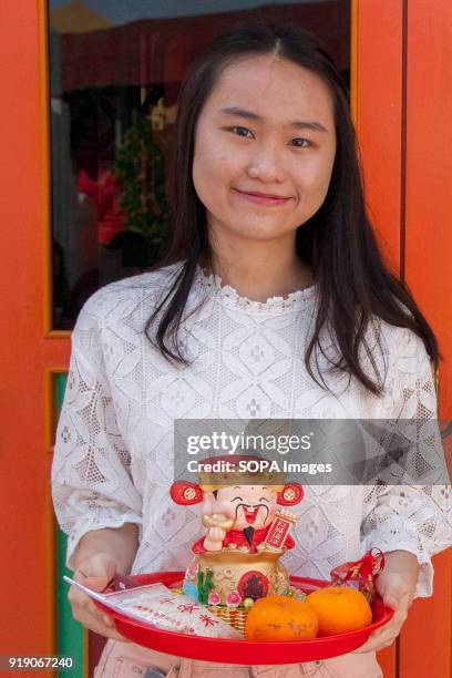 Lady seen with her offering basket at the Thean Hou Temple on the first day of Chinese New Year. Chinese New Year is the first day of the New Year in...