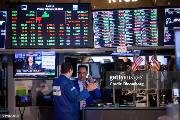 Traders work on the floor of the New York Stock Exchange in New York, U.S., on Friday, Feb. 16, 2018. U.S. Equities headed for the best week in six...