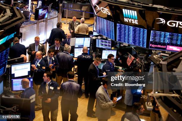 Traders work on the floor of the New York Stock Exchange in New York, U.S., on Friday, Feb. 16, 2018. U.S. Equities headed for the best week in six...