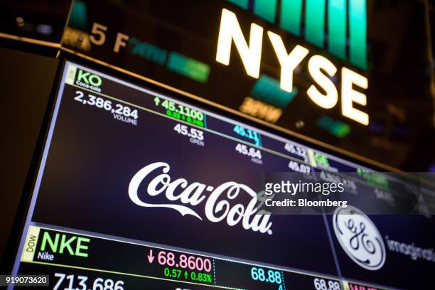 Monitor displays Coca-Cola Co. Signage on the floor of the New York Stock Exchange in New York, U.S., on Friday, Feb. 16, 2018. U.S. Equities headed...
