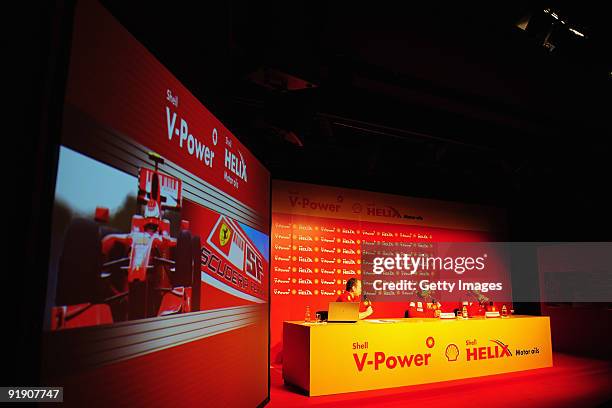 Giancarlo Fisichella of Italy and Ferrari and Kimi Raikkonen of Finland and Ferrari talk at a Shell press conference during previews to the Brazilian...