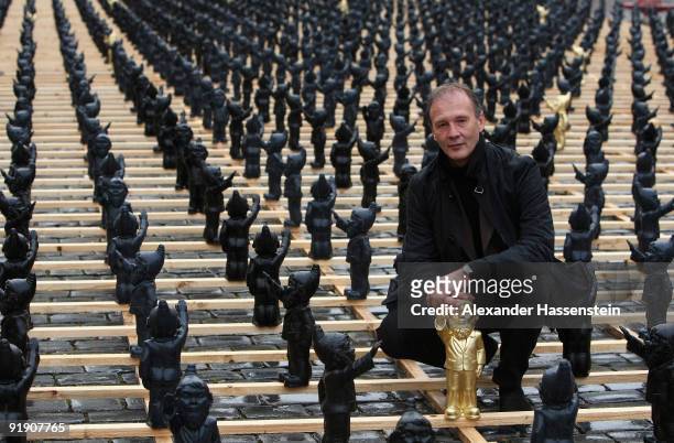 German artist Ottmar Hoerl poses after the opening ceremony of the art installation 'Dance with the Devil' at the main square of Straubing on October...