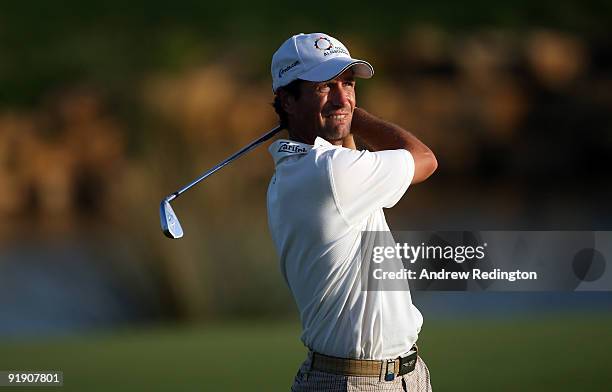 Steve Webster of England plays his second shot on the 18th hole during the first round of the Portugal Masters at the Oceanico Victoria Golf Course...