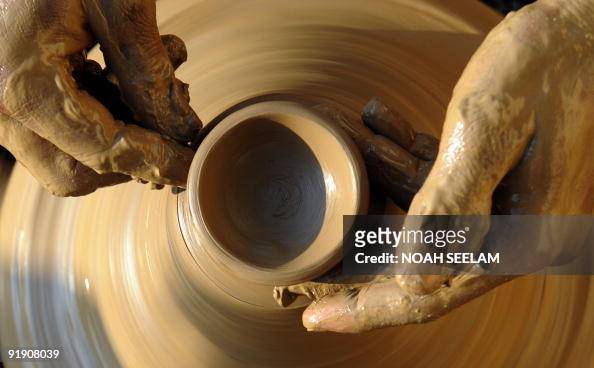 An Indian potter makes earthenware oil pots or 'diyas' at his... News Photo  - Getty Images