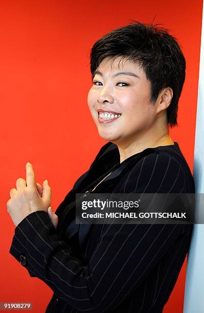 Chinese author and professor Yu Dan poses "Konfuzius im Herzen" at the 61st International Book Fair on October 15, 2009 in Frankfurt, where China is...