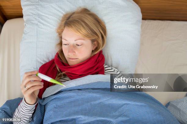 Bonn, Germany Posed Scene: A sick woman lies in bed on February 13, 2018 in Bonn, Germany.