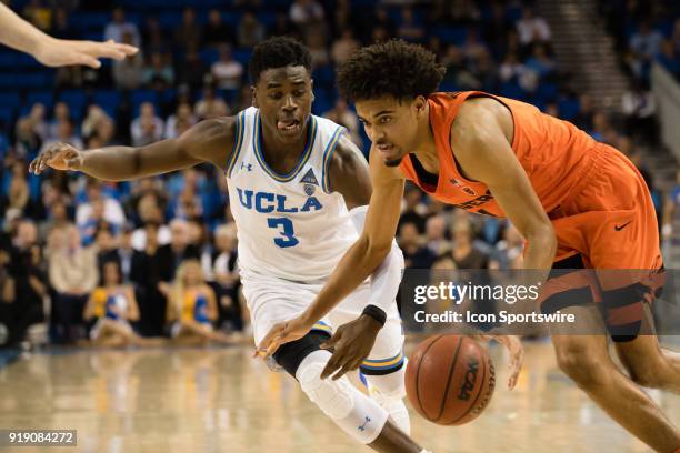 Bruins guard Aaron Holiday defends Oregon State Beavers guard Stephen Thompson Jr. As he looses control of the ball during the game between the...