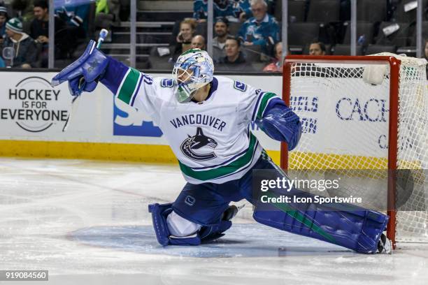 Vancouver Canucks goaltender Anders Nilsson makes a blocker save during the third period of the regular season game between the San Jose Sharks and...