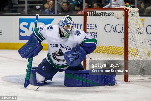 Vancouver Canucks goaltender Anders Nilsson watches the puck score during the third period of the regular season game between the San Jose Sharks and...