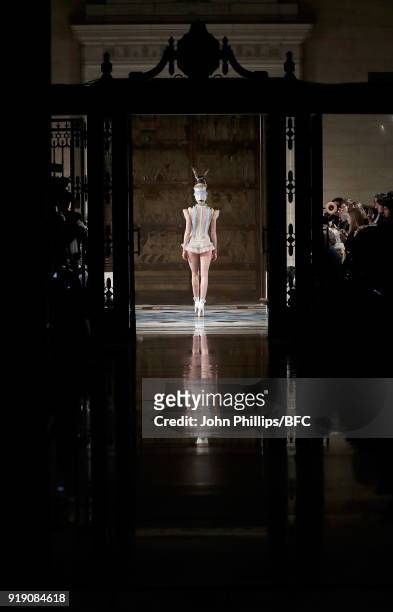 Model walks the runway at the Pam Hogg show during London Fashion Week February 2018 at The Freemason's Hall on February 16, 2018 in London, England.