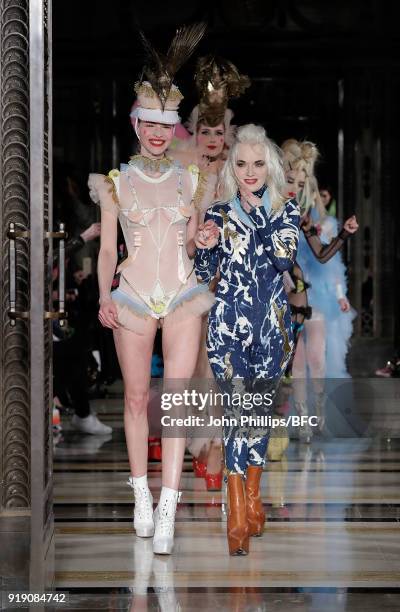 Designer Pam Hogg and a model walk the runway at the Pam Hogg show during London Fashion Week February 2018 at The Freemason's Hall on February 16,...