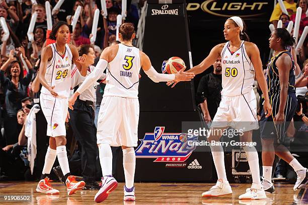 Diana Taurasi of the Phoenix Mercury celebrates with teammates DeWanna Bonner and Tangela Smith in Game Five of the WNBA Finals against the Indiana...