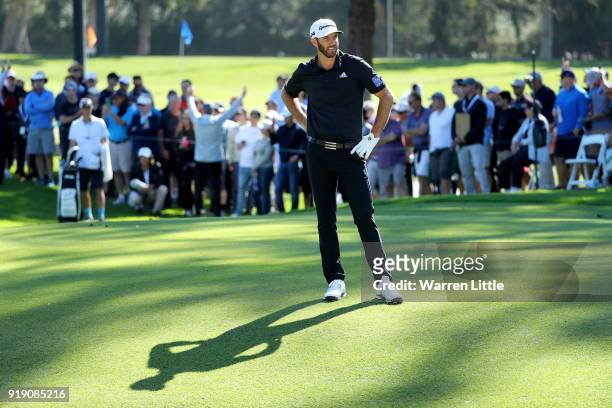 Dustin Johnson lines up a shot on the second hole during the second round of the Genesis Open at Riviera Country Club on February 16, 2018 in Pacific...