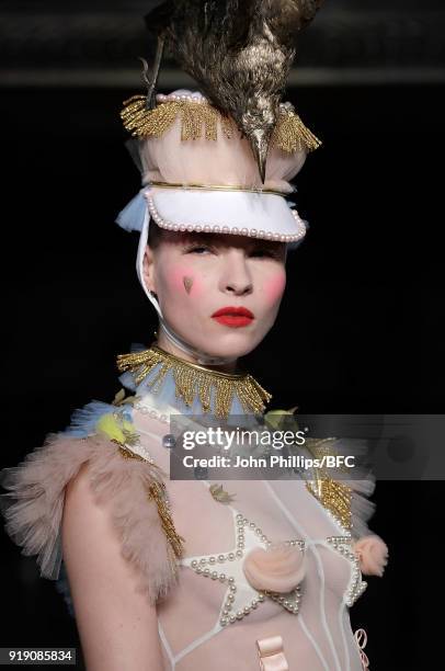 Model walks the runway at the Pam Hogg show during London Fashion Week February 2018 at The Freemason's Hall on February 16, 2018 in London, England.