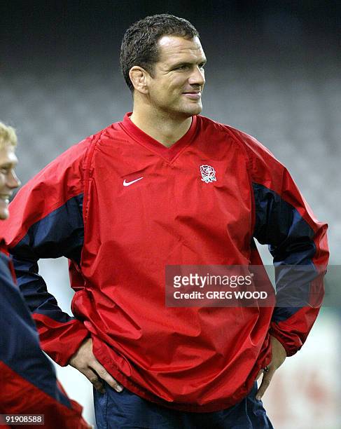 Martin Johnson, captain of England's World Cup rugby team, smiles during the Captain's Run for the Rugby World Cup at the Docklands Stadium in...