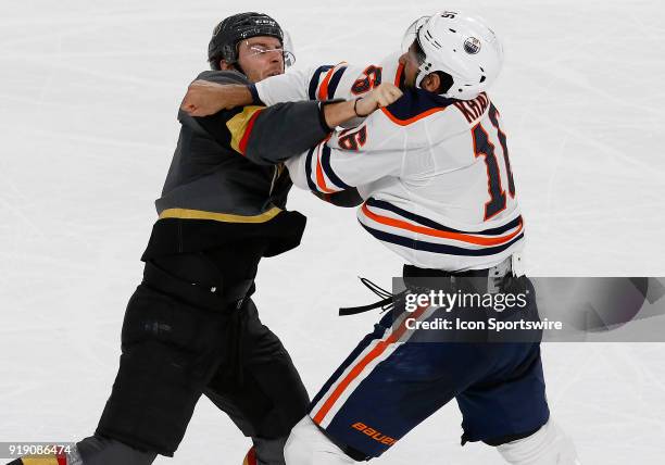 Vegas Golden Knights defenseman Colin Miller and Edmonton Oilers left wing Jujhar Khaira fight during the third period of a regular season NHL game...