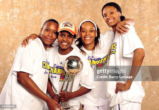 Le'coe Willingham, assistant coach Bridget Pettis, Tangela Smith and DeWanna Bonner of the Phoenix Mercury pose with the WNBA Championship Trophy...