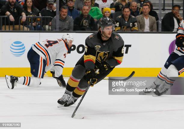 Vegas Golden Knights defenseman Colin Miller looks to pass the puck during the second period of a regular season NHL game between the Edmonton Oilers...